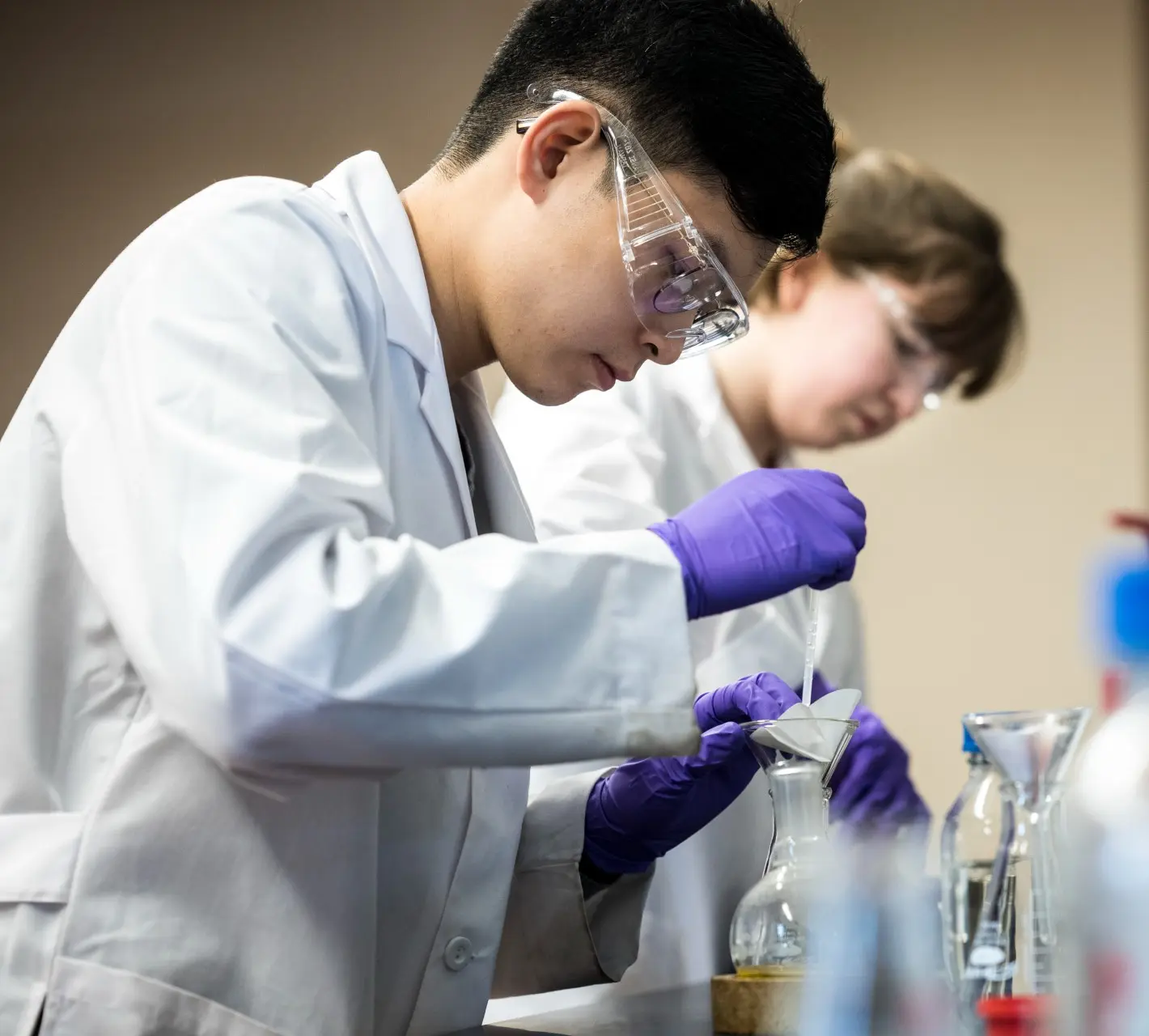 Asian male student working in a lab